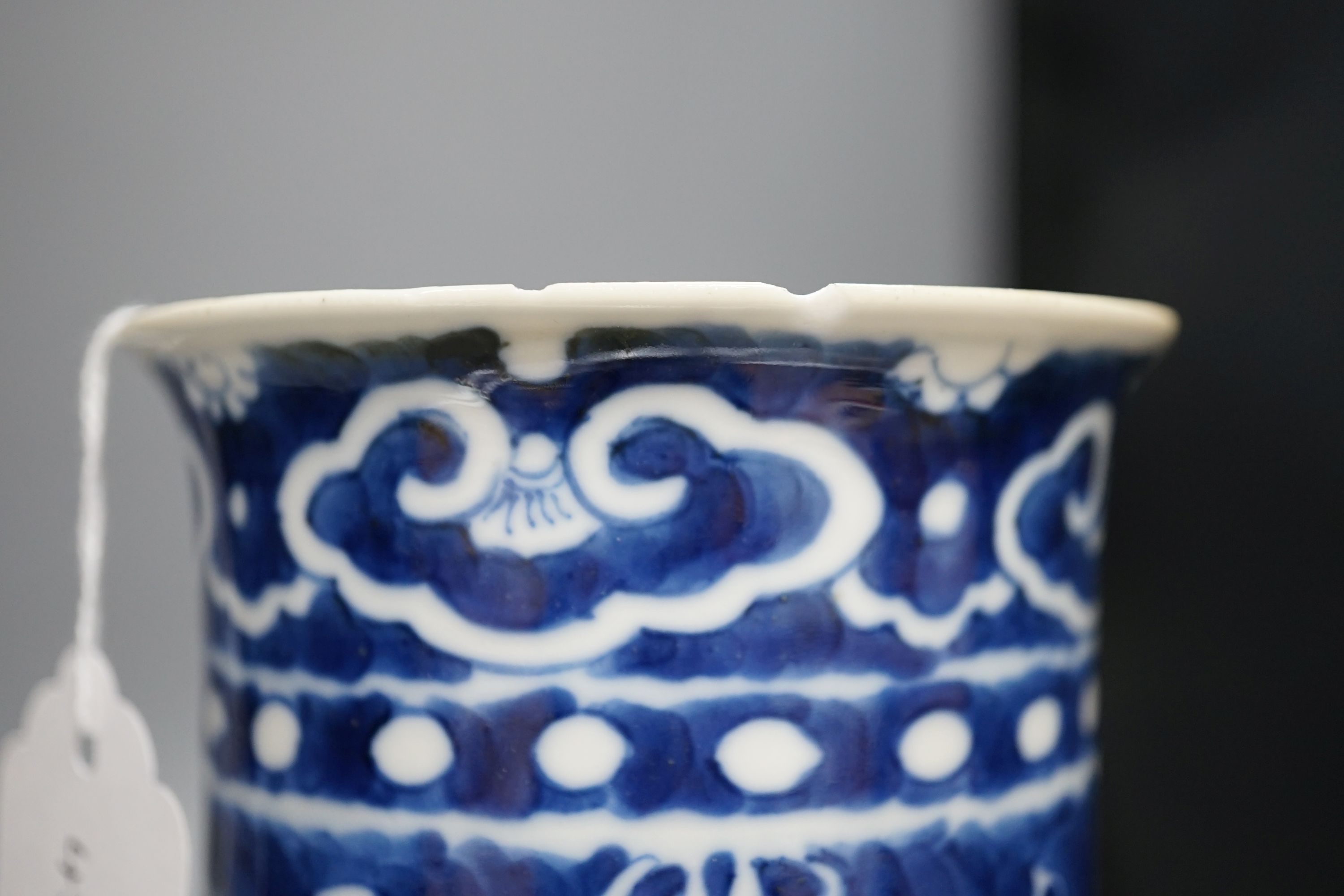 A Chinese blue and white sleeve vase and small famille rose vase, sleeve vase 25 cms high.
